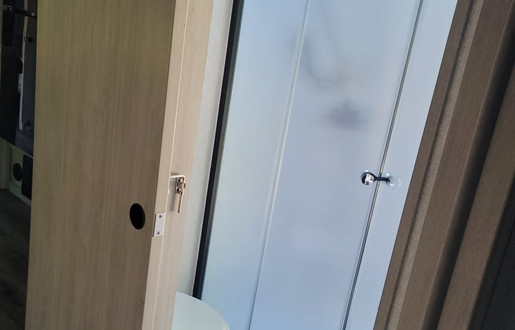 Large standing shower with doors!