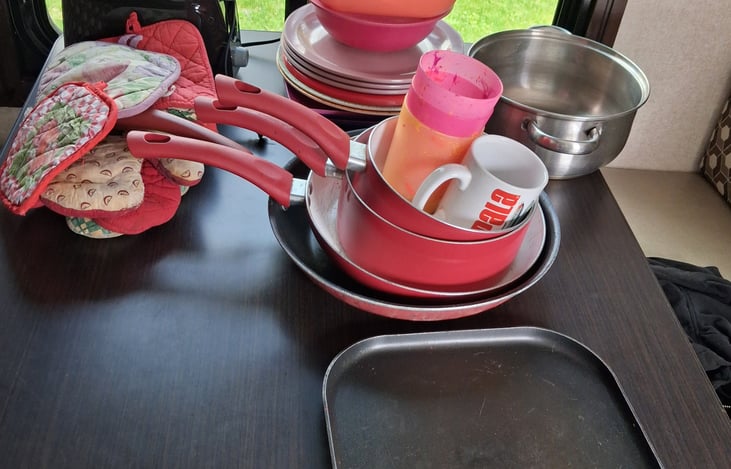 Pots, pans, toaster, plates, cups, hot pads, silverware