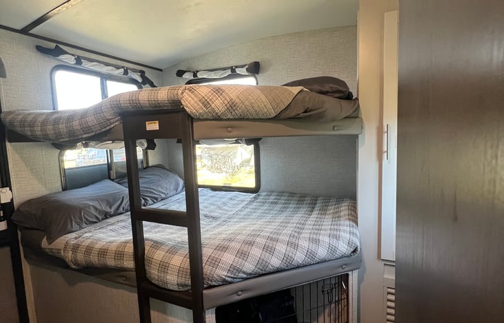 Bunk room with closet and extra storage