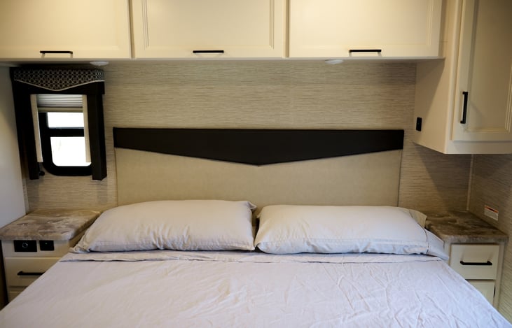 master bedroom has plenty of storage, multiple windows, blinds and features built-in electric outlets as well as USB cables.