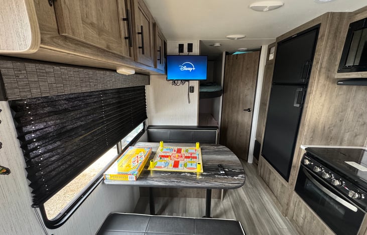 Dinner table and full size bed.