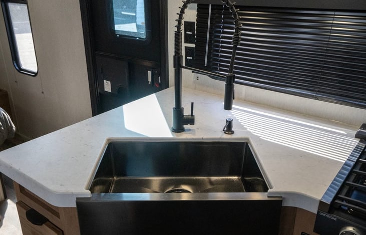 Modern deep black sink with flexible pull-down faucet