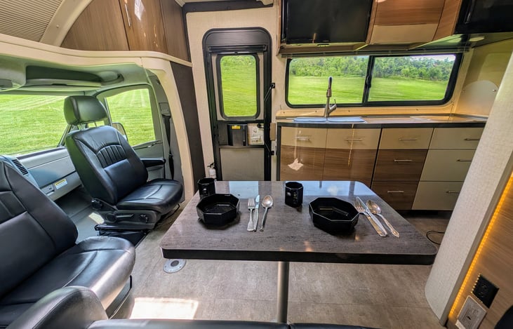 Classy and well-appointed interior with ample storage and premium materials throughout. Swing around captain's chairs and 2 positions for the dining table create a comfortable and flexible environment