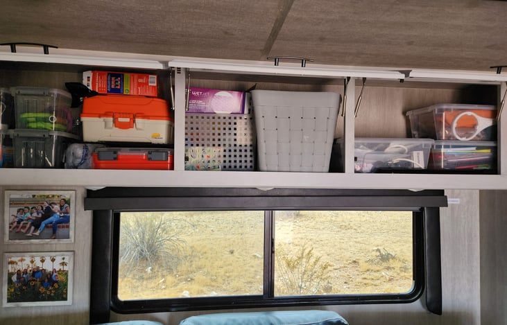 There is plenty of storage and items for use above the counter. First Aid Kits, Vacuum Hose, lighters, etc.