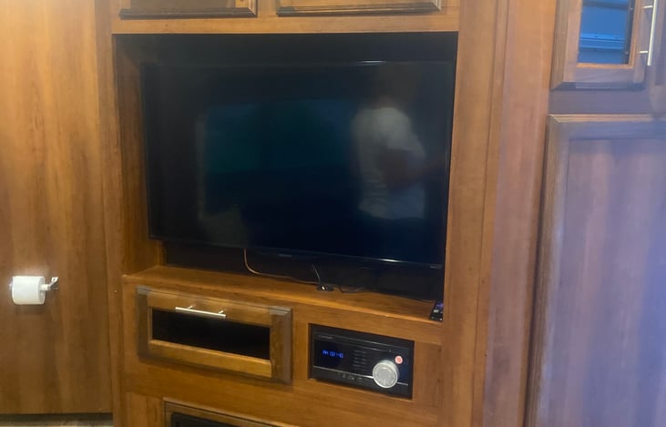 Smart Tv with entertainment area. Fireplace as well.