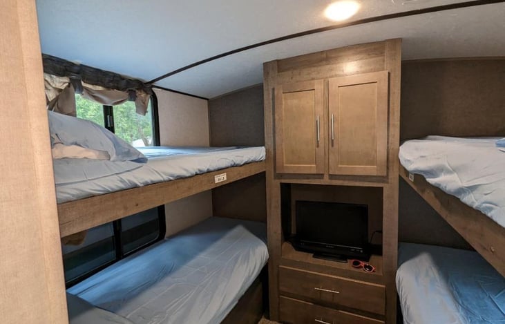 Double bunk beds (sleeps 4) and storage.