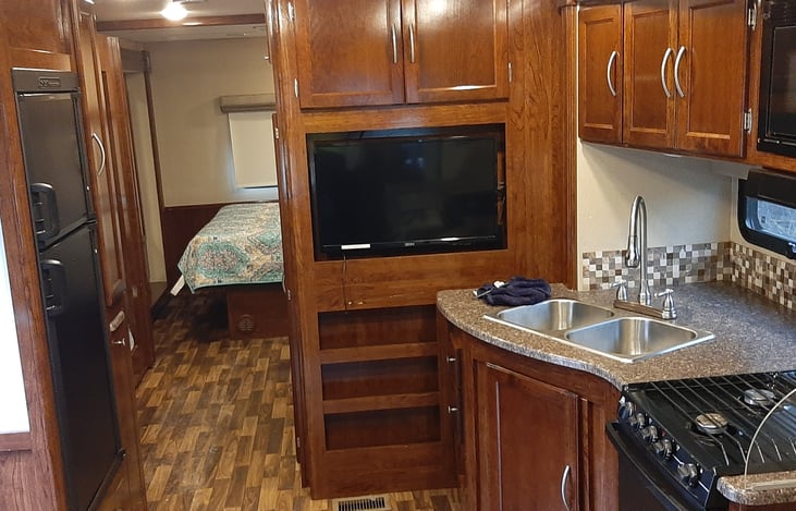 Galley with picture of flat screen tv.