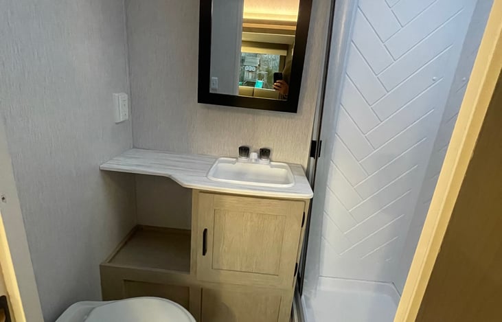 Full bathroom with shower and sink.