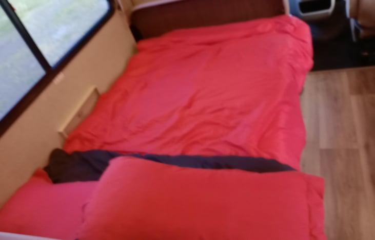 This is the table folded down to make a bed we provide clean sheets pillows and blankets.