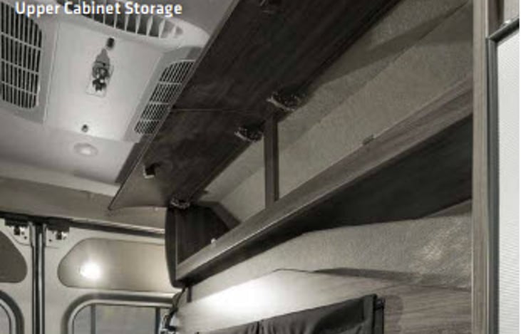 Above the bed there is storage space.  On the back there are two reading lights.