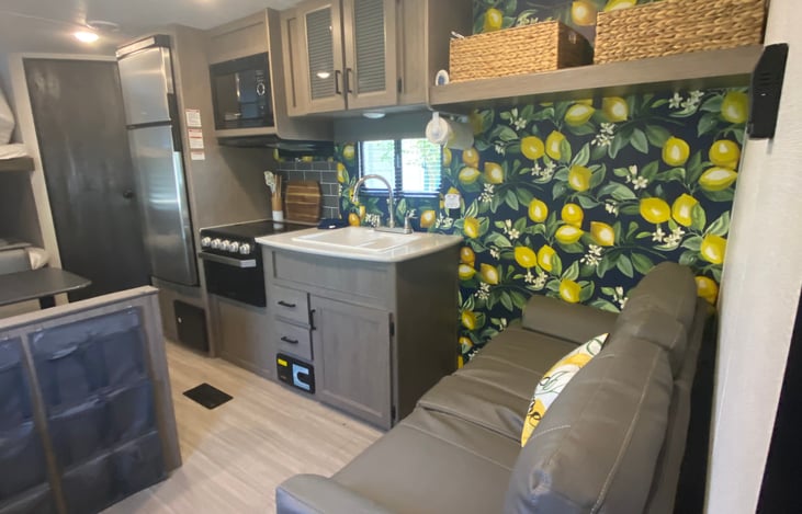 Living area. Both couch and table turn into a bed.