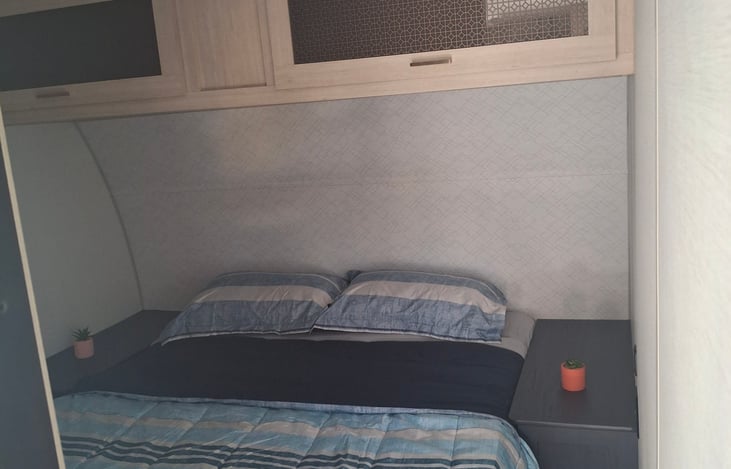 Bedroom includes a sliding door for privacy