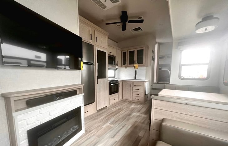 Common area features an electric fireplace and tv