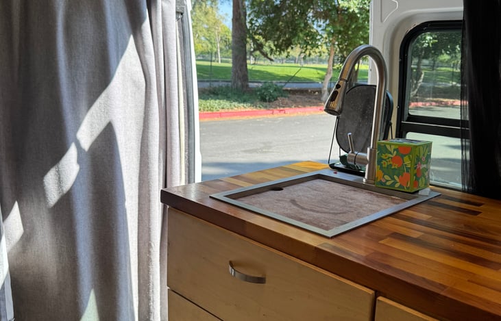 Interior view of sink with side door open.