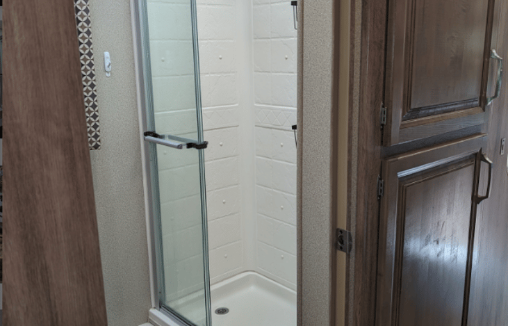 Bathroom has plenty of storage for everyone's bathroom accessories.