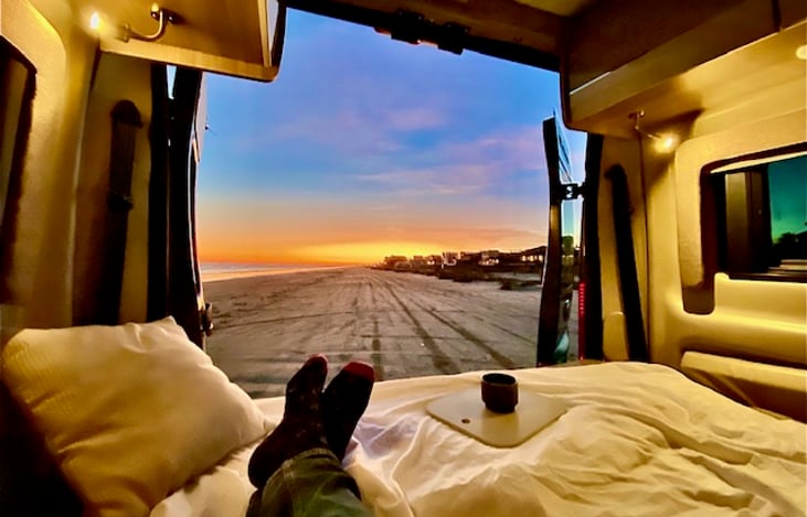 Back doors swing wide open and includes a snap on screen (not shown) to enjoy the seaside breeze while you relax on your RV King sized bed.