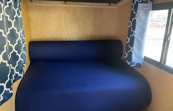 Sofa converts into a full size bed. Curtains for maximum privacy.