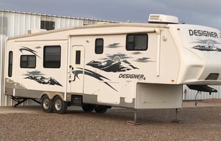 A 5th wheel travel trailer suited for 2 people