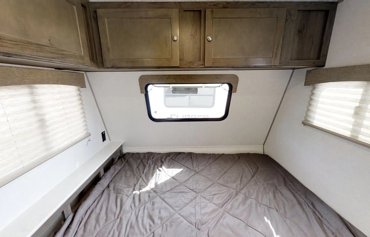 Spacious, full-size bed with over-head and headboard storage