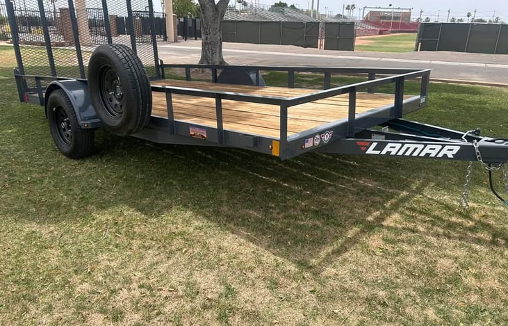 Reliable 7x14 Lamar Utility Trailer – Add on to your Rental $50 a day.  It's the perfect workhorse for moving furniture, landscaping materials, equipment, ATVs, and more. Spacious deck & easy to tow.