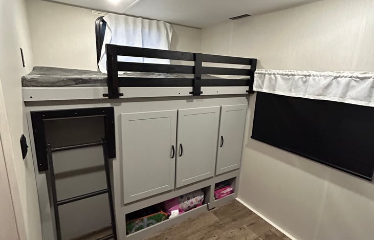 This oversized top bunk serves as the perfect place for kiddos with the added railing to keep them safe.  The closet under the bunk offers plenty of storage