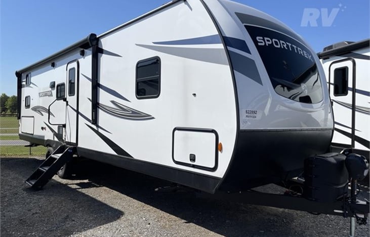 30 foot living space with 20 ft powered awning with lights.  Thru storage in front.  Electric trailer jack