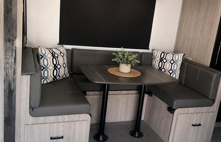"Smoky Pass" features a spacious, centrally located U-shaped dinette.  This flexible dining configuration serves as a multi-functional hub and additional sleeping capacity.
