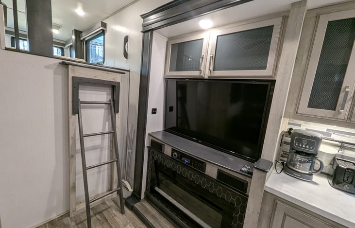 The ultimate hub! Features a chef’s kitchen, theatre recliners facing a 50" TV and fireplace, plus a cozy overhead loft. Luxury meets comfort in this massive, open-concept living space.