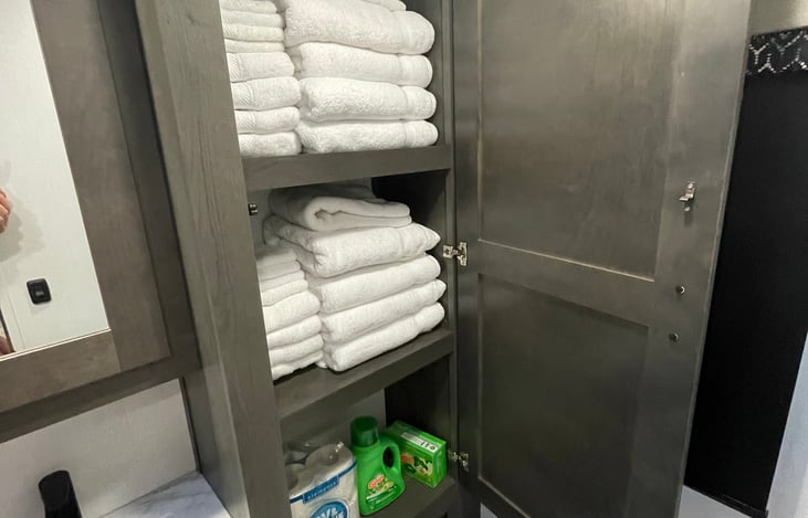 Stocked with 8 towels, hand towels, wash cloths, toilet paper, laundry detergent, fabric softener sheets