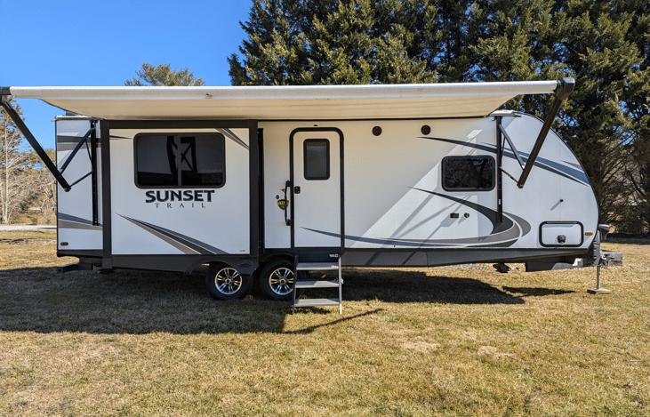 Luxury 30' triple-slide trailer with a gourmet rear kitchen & private master suite. Massive open-concept living and theater seating—the ultimate upscale home on wheels for your next getaway!