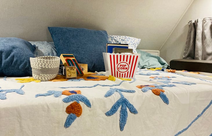 Kingsized bunk bed above the cab with electric access.