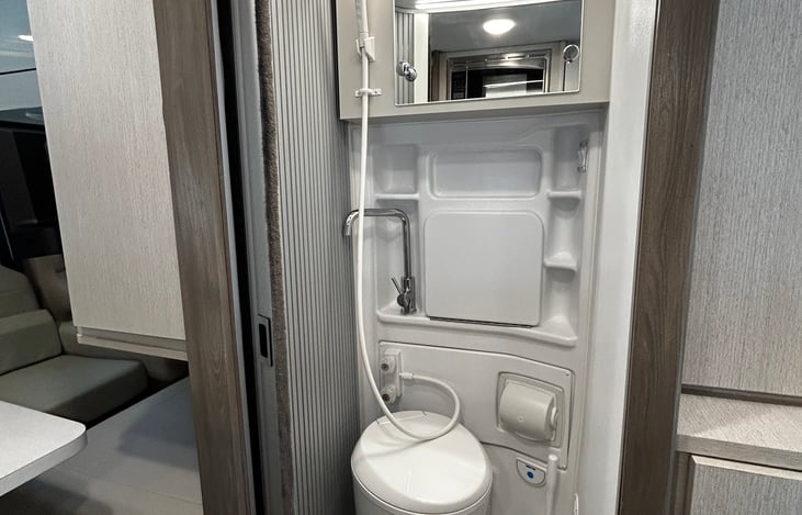 Wet bath with toilet and sink. Inside the medicine cabinet you’ll find extra toilet paper, cleaning supplies and a first aid kit.