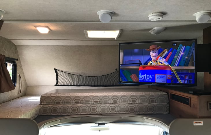 Electric swing arm 32" tv with DVD player.  TV will swing out for viewing from couch/dinette.