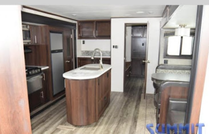 Kitchen with island and pantry. Fold down Table