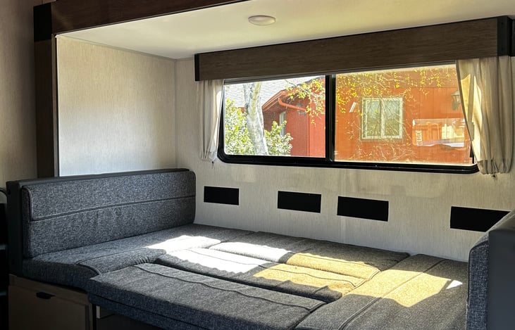 Dining room table folds down into a bed.