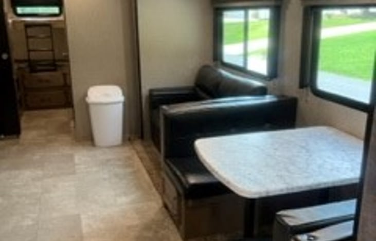 Dinette and couch. Couch and dinette can be converted into sleeping areas.