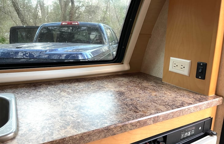 There are four electrical outlets, conveniently located, above the counters.