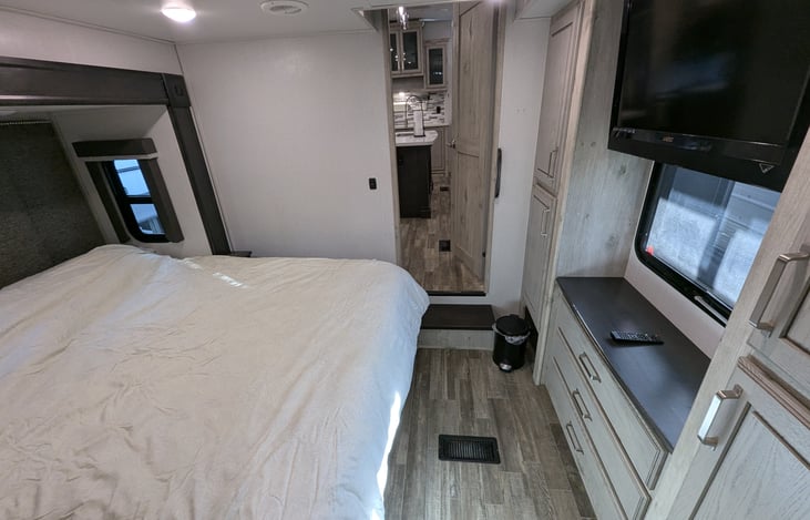 The ultimate guest retreat! This second master suite features a plush queen bed, massive wardrobe, and its own private full bathroom. Total privacy and comfort for friends or extended family.
