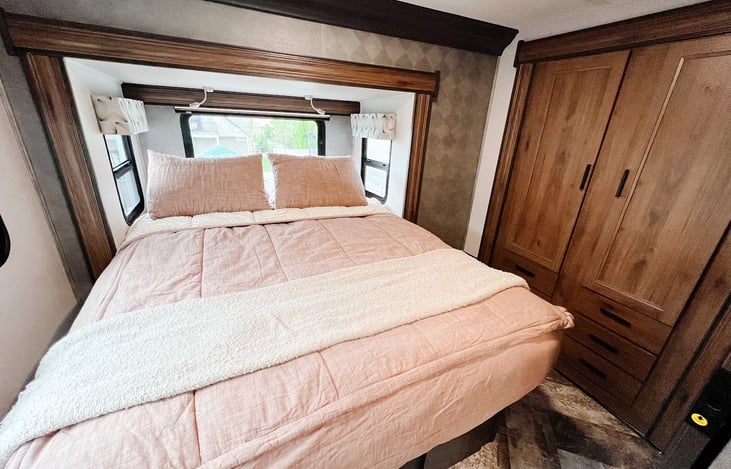 Full walk around bed with large wardrobe