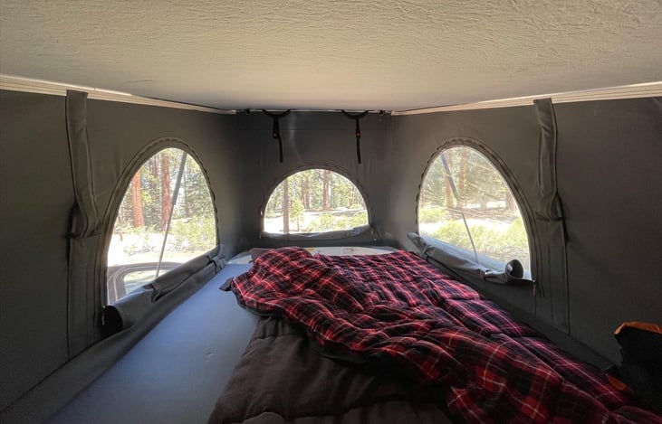 Pop-top tent bed space from inside