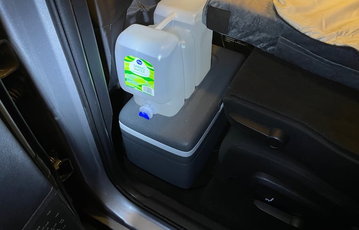 There is still lots of floor space to stow the cooler and camp box overnight on the 1st or 2nd row of seats.