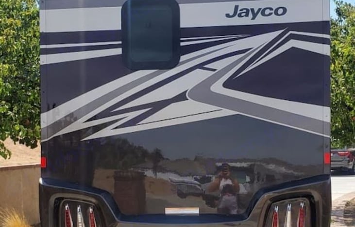 Back of the Rv. Visible bathroom window.