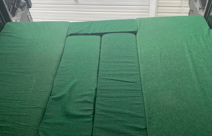 To convert to bed - place extra mattress piece in space by rear door