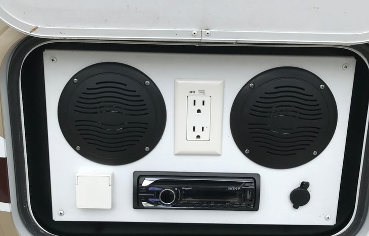 Exterior entertainment center with radio, cd player and smart phone hook up to play all your favorite music.