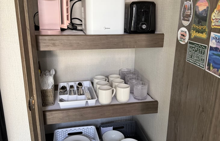 Includes ice maker, coffee maker, toaster and all the dishes and flatware you need.