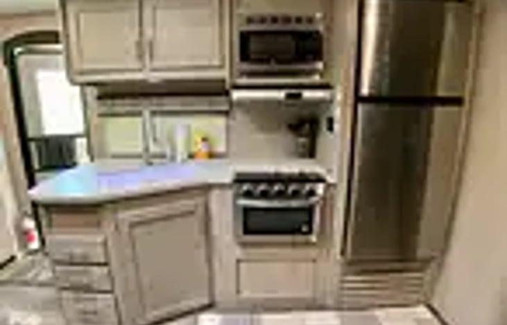 Kitchen area with frig to store all your items