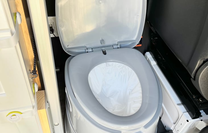 Portable toilet with detachable inner bucket. All the related materials (bags, napkins, toilet paper) are included.