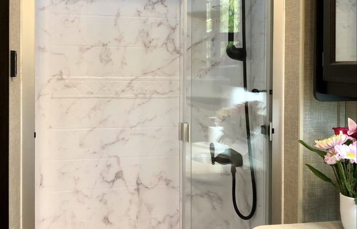 Extra spacious shower in main bathroom.