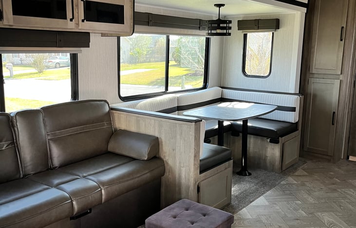 couch and dining room with big picture window