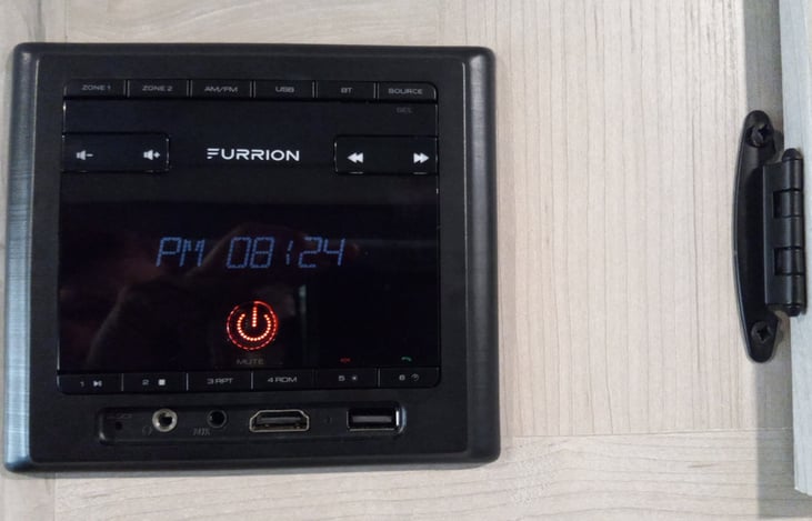 The RV is stocked with a Furrion System, to play music, podcasts, and other audio media. This system is equipped with indoor/outdoor speakers, for a full entertainment experience